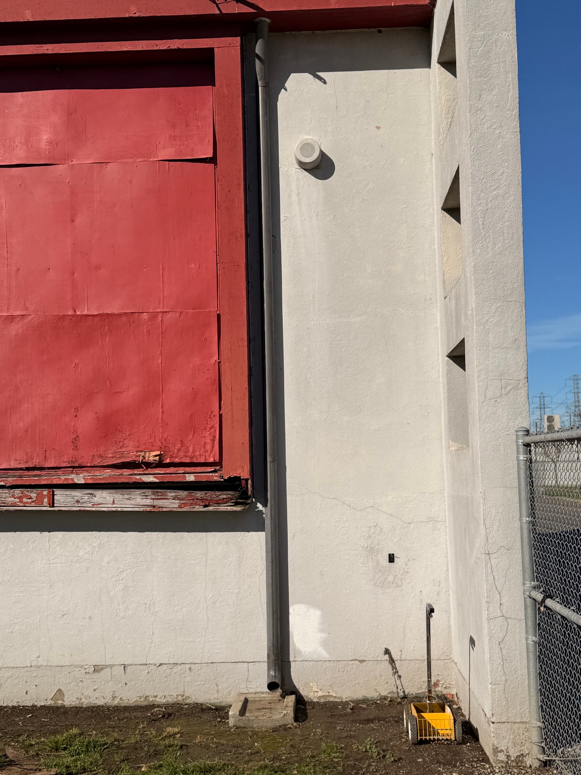New gutter section mounted on commercial building replacing damaged section